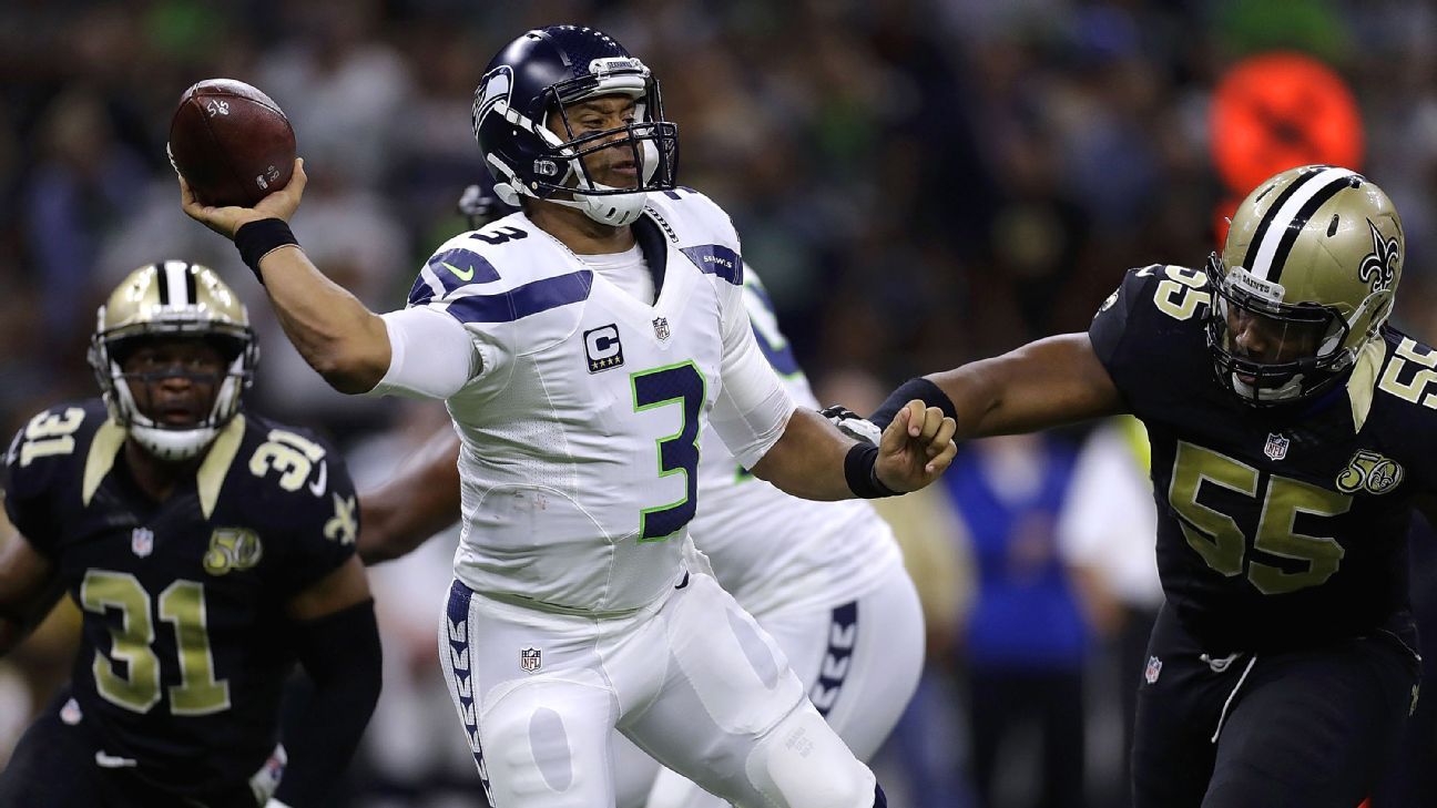 Russell Wilson of Seattle Seahawks doesn't share Cam Newton's concerns about officiating when taking hits