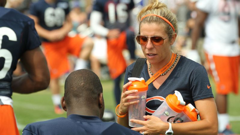 Jennifer Gibson, the Chicago Bears' sports science coordinator and dietitian, works with a Bears player during practice.