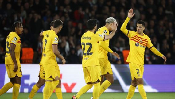 Barcelona players celebrate a goal against PSG, with Lionel Messi leading the charge. (barcelona vs psg champions league goal celebration messi)
