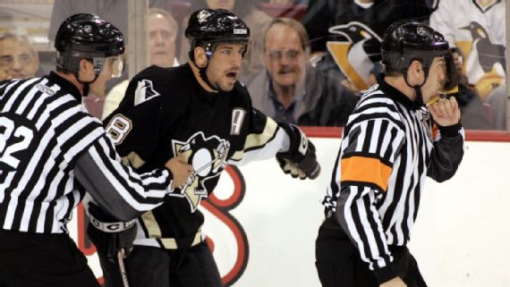 Referee signaling penalty
