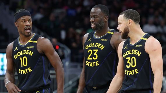 Jimmy Butler y Stephen Curry con los Warriors