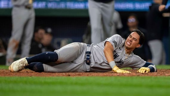 Oswaldo Cabrera being assisted off the field