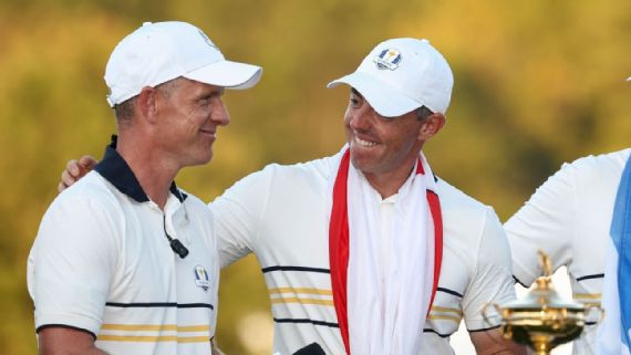 Luke Donald and Rory McIlroy celebrating Ryder Cup win.