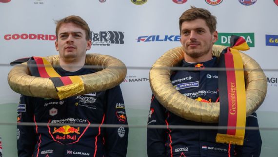 Christopher Lulham (L) and Max Verstappen on the podium after winning the GT3 endurance race.