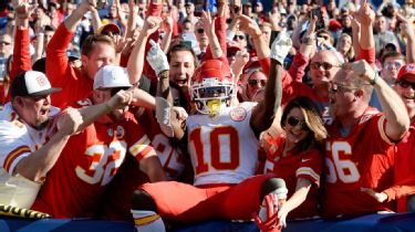 Fans participate in games at the fan plaza before an NFL football