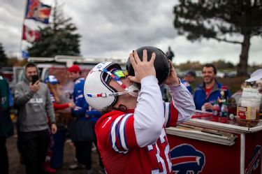 Tailgating Bills fans burned a Brady jersey, jumped off an RV to