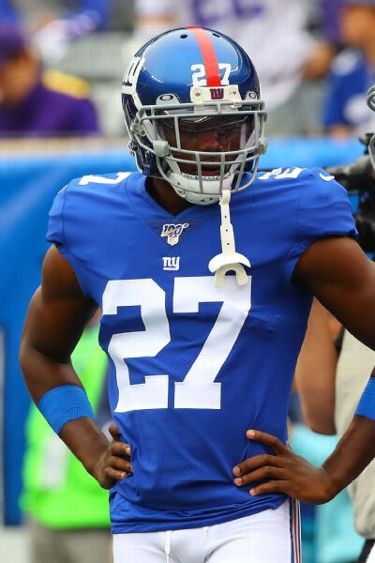 New York Giants cornerback Deandre Baker (27) breaks up a pass to