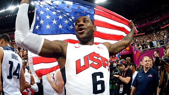 USA's Kobe Bryant holds up his USA jersey as he celebrates a win over Spain  to claim the gold medal for Men's Basketball during the 2008 Summer Olympics  in Beijing on August