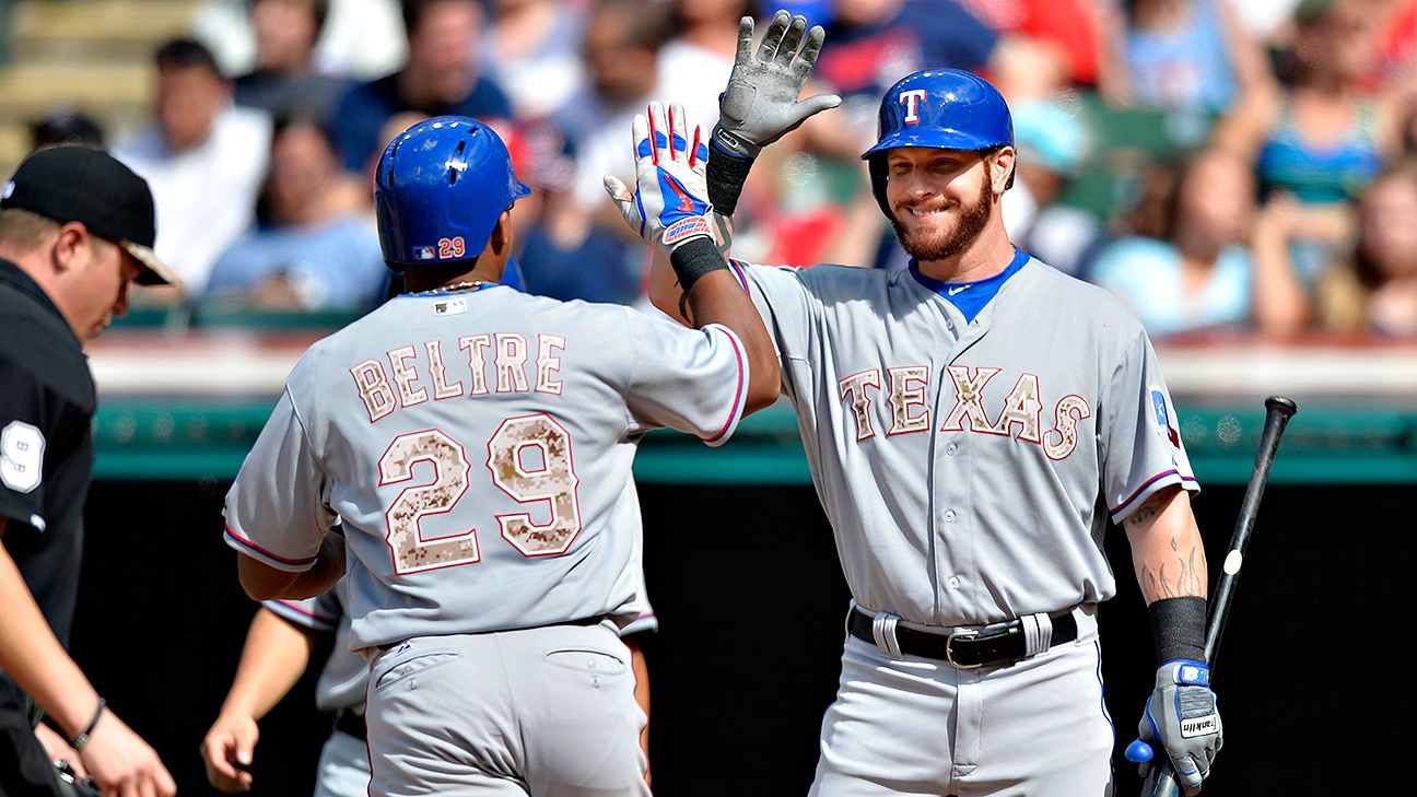 Former Texas Rangers player, Adrian Beltre (left) waves to the