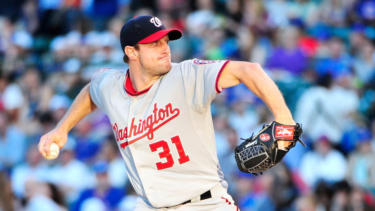 Washington Nationals starting pitcher Max Scherzer, left, stands