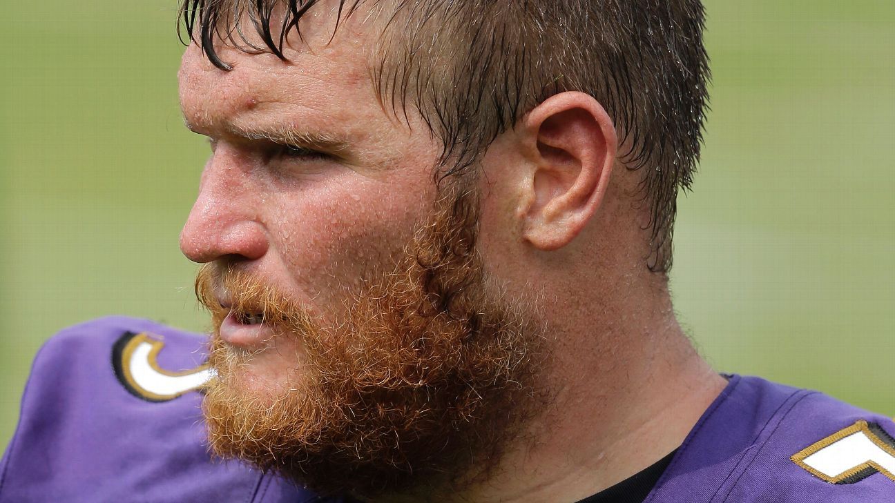 Baltimore Ravens' Marshal Yanda spits at Bengals' Vontaze Burfict