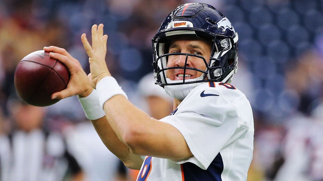 Denver Broncos quarterback Peyton Manning (18) watches a replay against the  Detroit Lions during the first half of an NFL football game, Sunday, Sept.  27, 2015, in Detroit. (AP Photo/Paul Sancya Stock