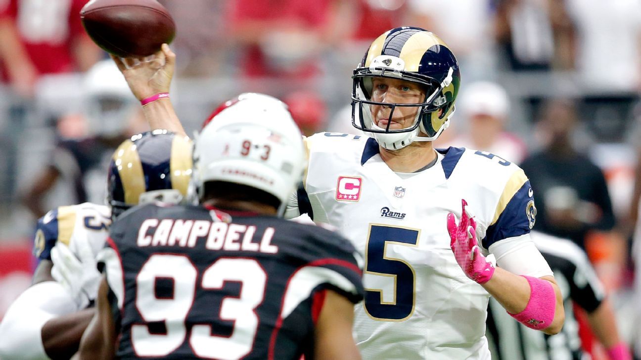 Quarterback Nick Foles of the St. Louis Rams walks off the field