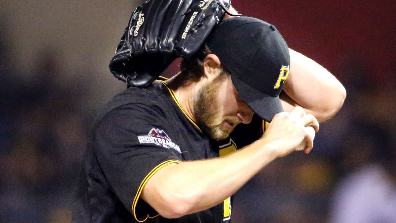 Pitcher Gerrit Cole of the Pittsburgh Pirates rests on the bench in