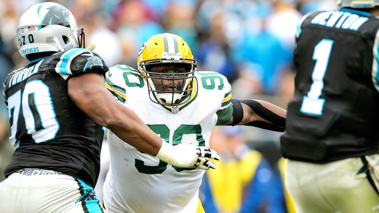 Green Bay Packers defensive tackle B.J. Raji blows kisses to fans