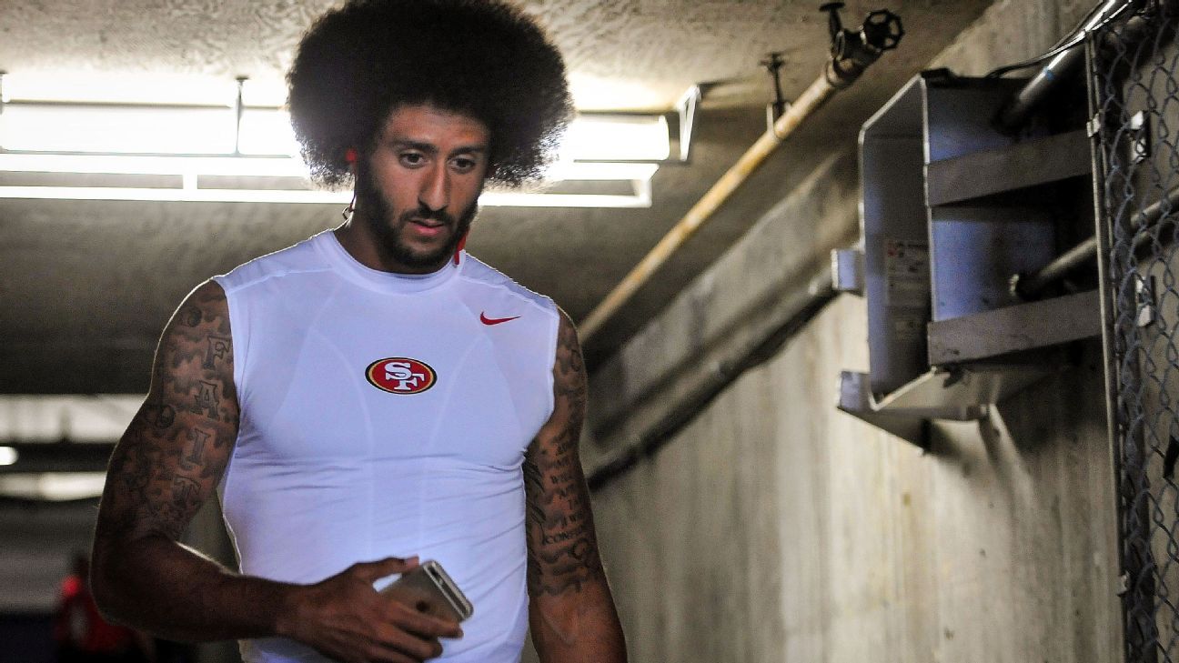 POLL: Is San Francisco 49'ers QB Colin Kaepernick at fault for choosing to  sit during the national anthem?