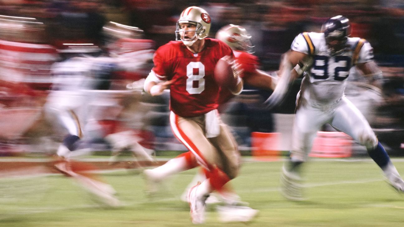 San Francisco 49ers quarterback Steve Young runs into the end zone