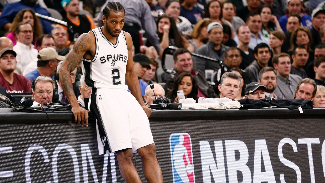 San Antonio Spurs forward Kawhi Leonard delivers gifts dressed as Santa