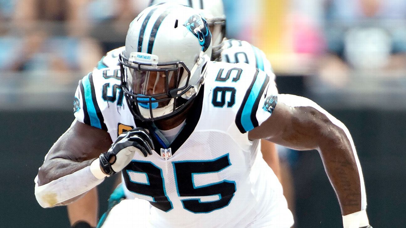 Carolina Panthers' Charles Johnson (95) glances over toward