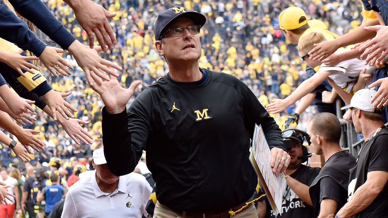 Michigan football coach Jim Harbaugh focused on winning a national title after b..