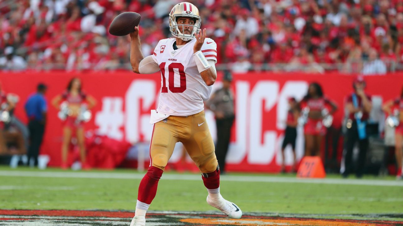 Las Vegas Raiders quarterback Jimmy Garoppolo (10) wipes away