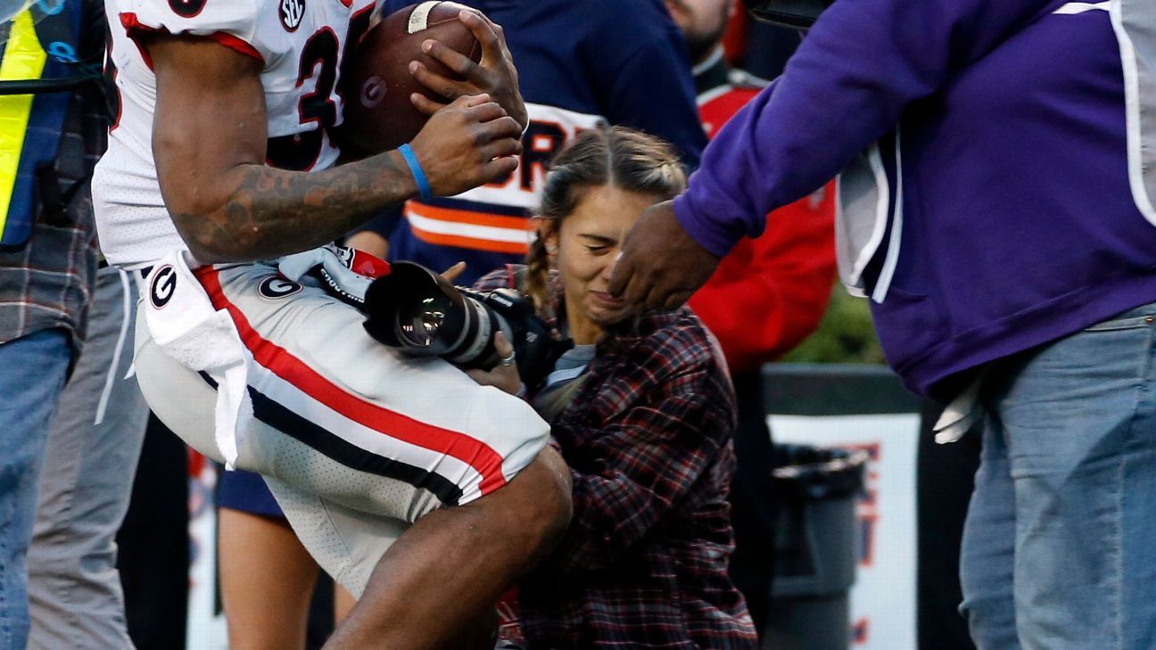 Photog hit at UGA-Auburn game sent to hospital