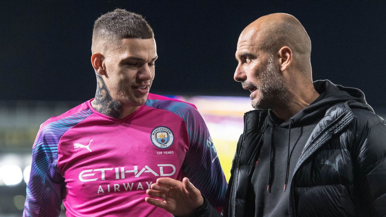 Pep Guardiola in conversation with Ederson.