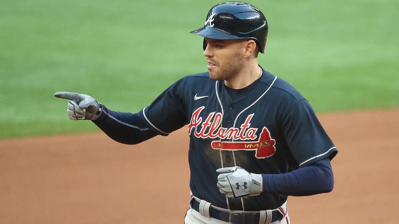 ATLANTA, GA - APRIL 11: Atlanta Braves first baseman Freddie Freeman (5)  with his 2020 NL MVP award prior to the MLB game between the Philadelphia  Phillies and Atlanta Braves on April