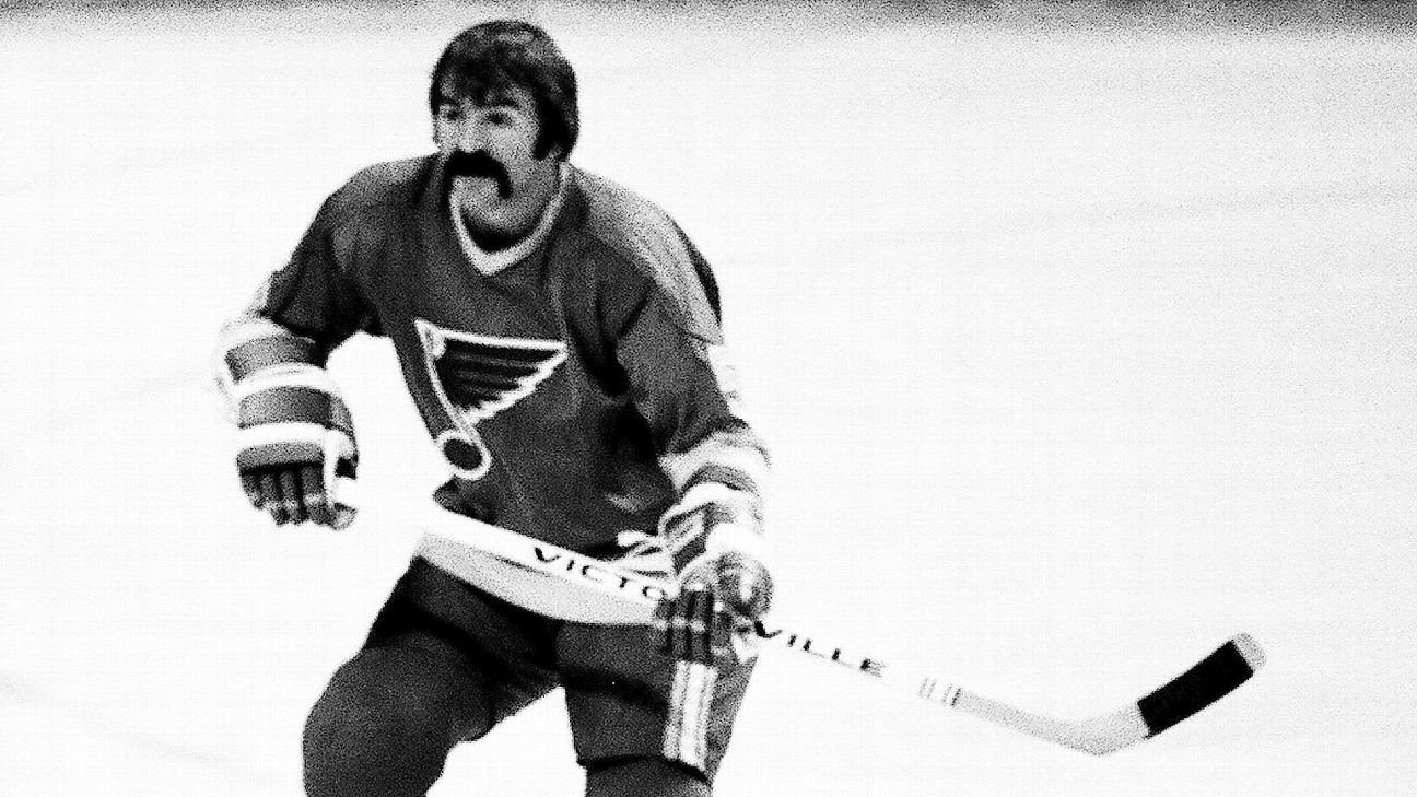 Former St. Louis Blues Captain Bob Plager waves to the crowd as he