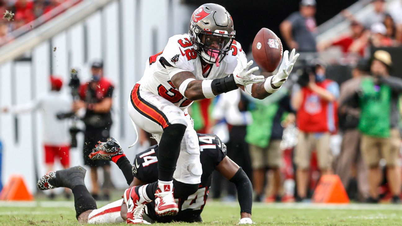 Tampa Bay Buccaneers wide receiver Chris Godwin (14) catches a pass over  Atlanta Falcons corner …