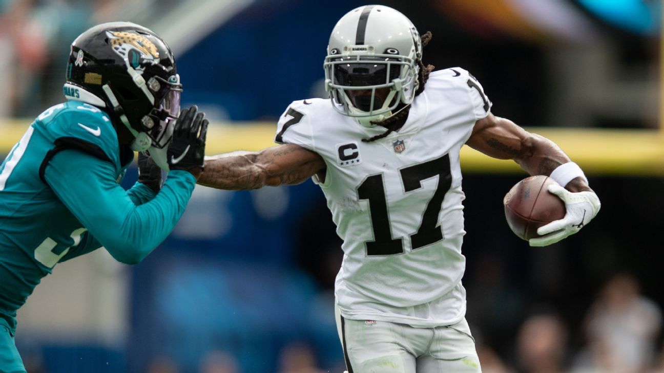 Raiders wide receiver Davante Adams (17) runs after a catch pulls