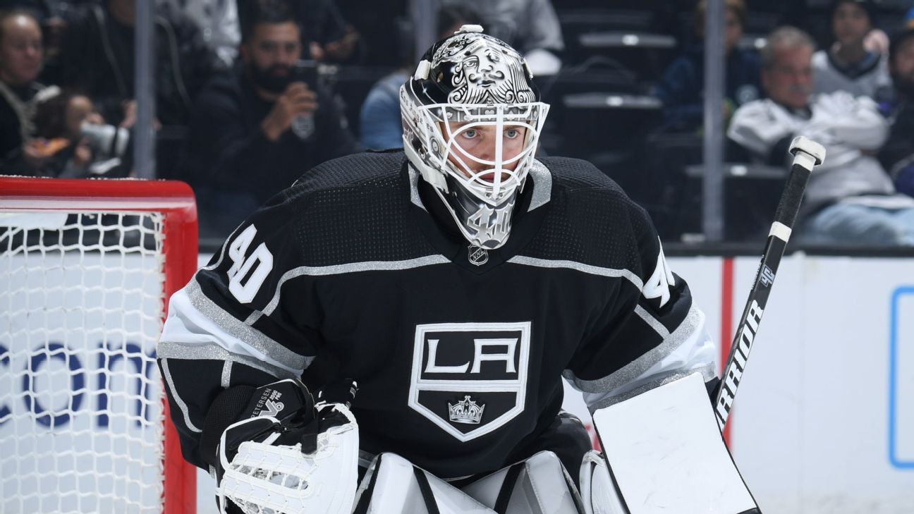 FILE - Los Angeles Kings goaltender Calvin Petersen (40) wears a  Pride-themed jersey and holds a stick wrapped in rainbow tape for Pride  night while warming up before an NHL hockey game