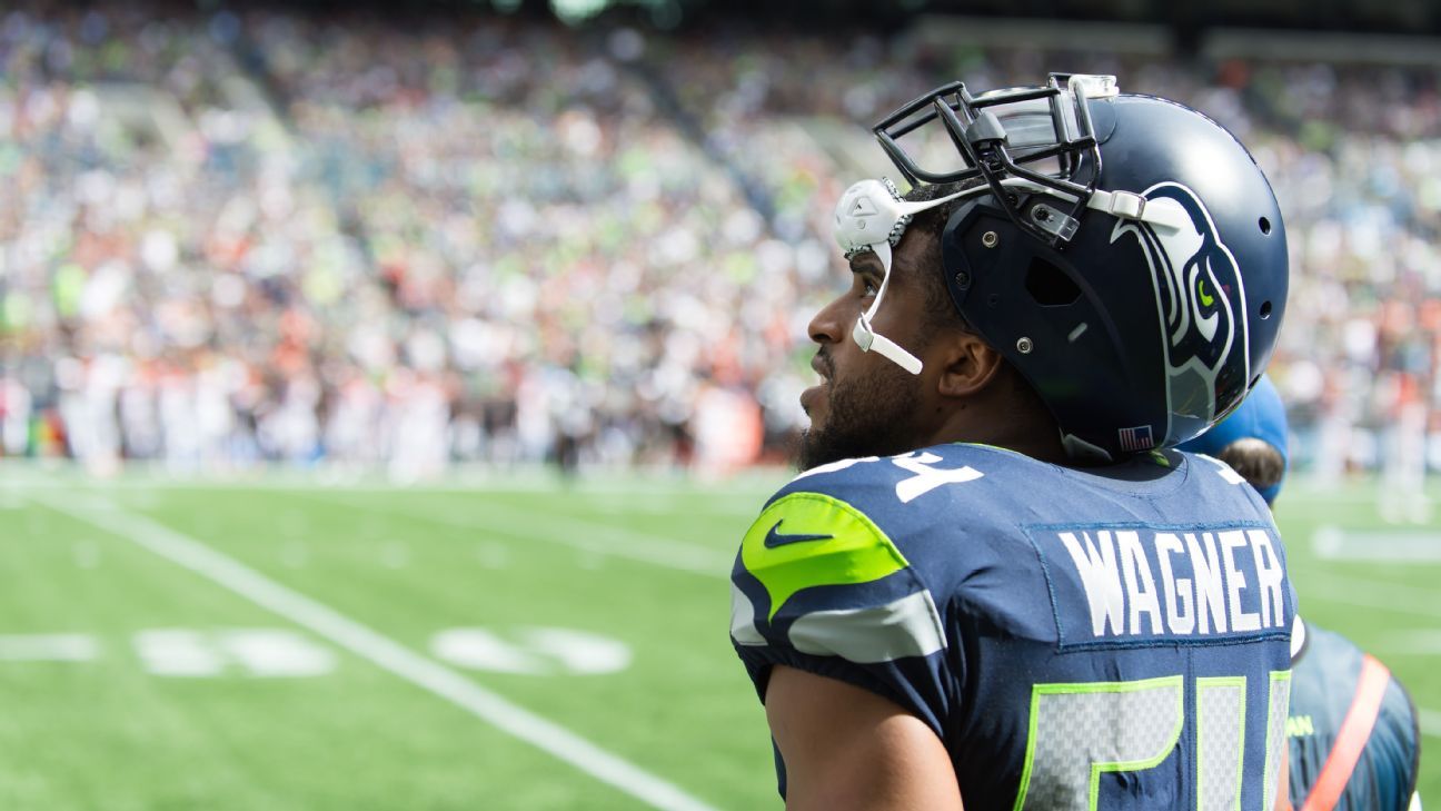 Seattle Seahawks players pose with their Super Bowl rings