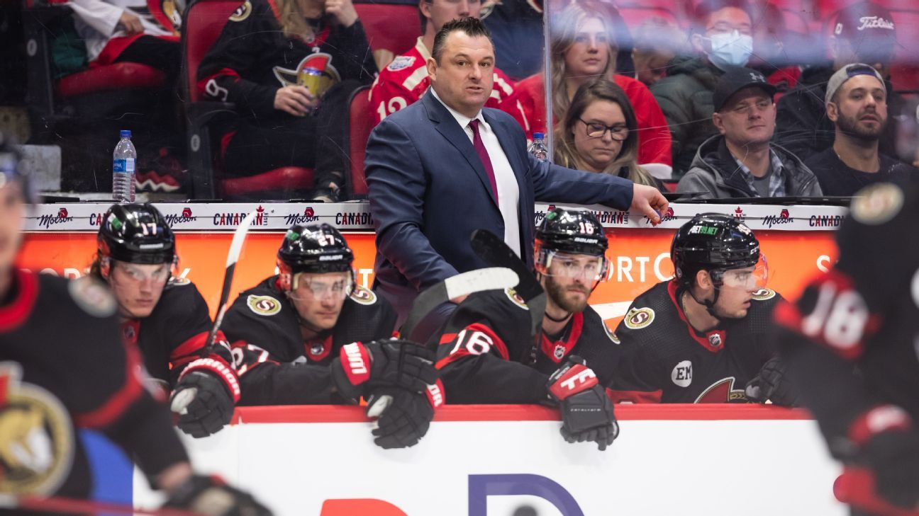 Head coach D.J. Smith embraces Senators Pride Night