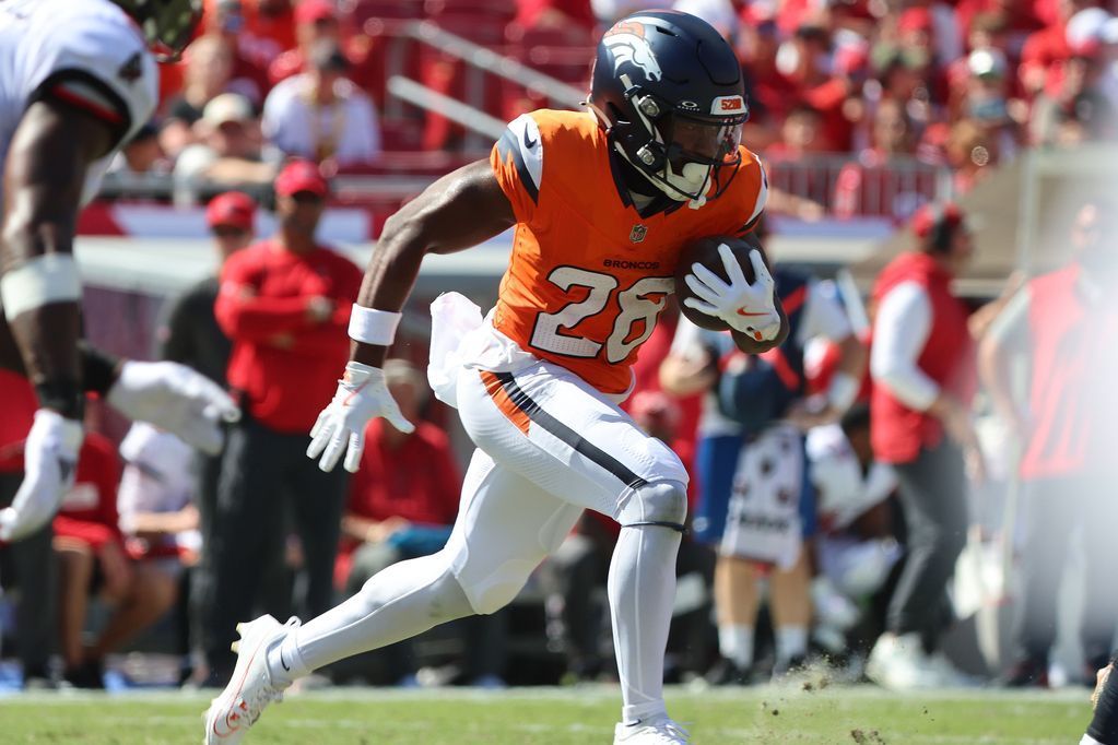 Broncos RB Tyler Badie (back) was carried away on the backboard