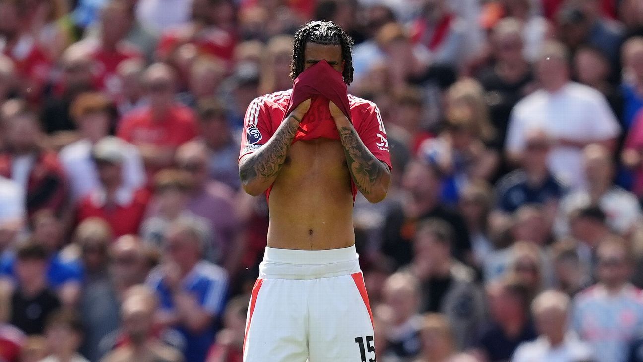 Manchester United's Leny Yoro leaves the field after picking up an injury against West Ham.