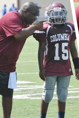Titans Cam Ward: Father's Day & His Dad's Influence calvin Ward talks with his son,Cameron,during a youth football game.