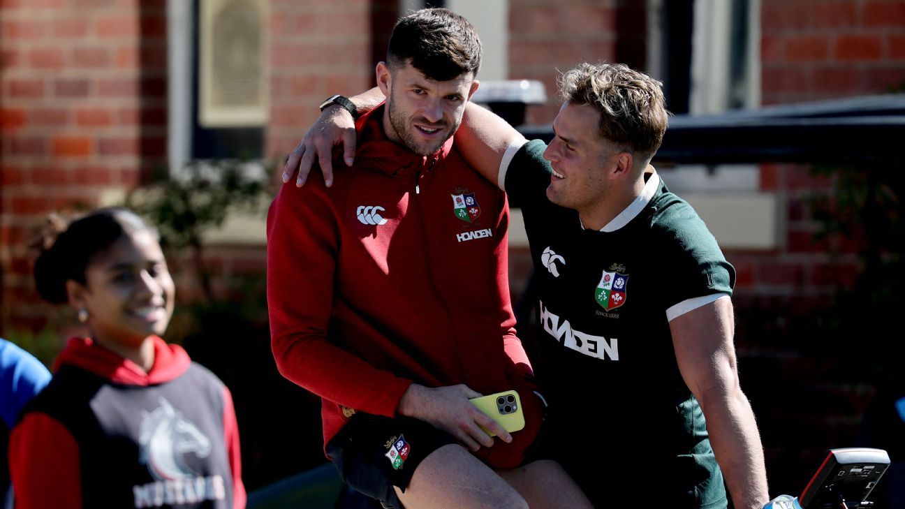 British and Irish Lions' Blair Kinghorn (C) talks to his teammate Duhan Van Der Merwe