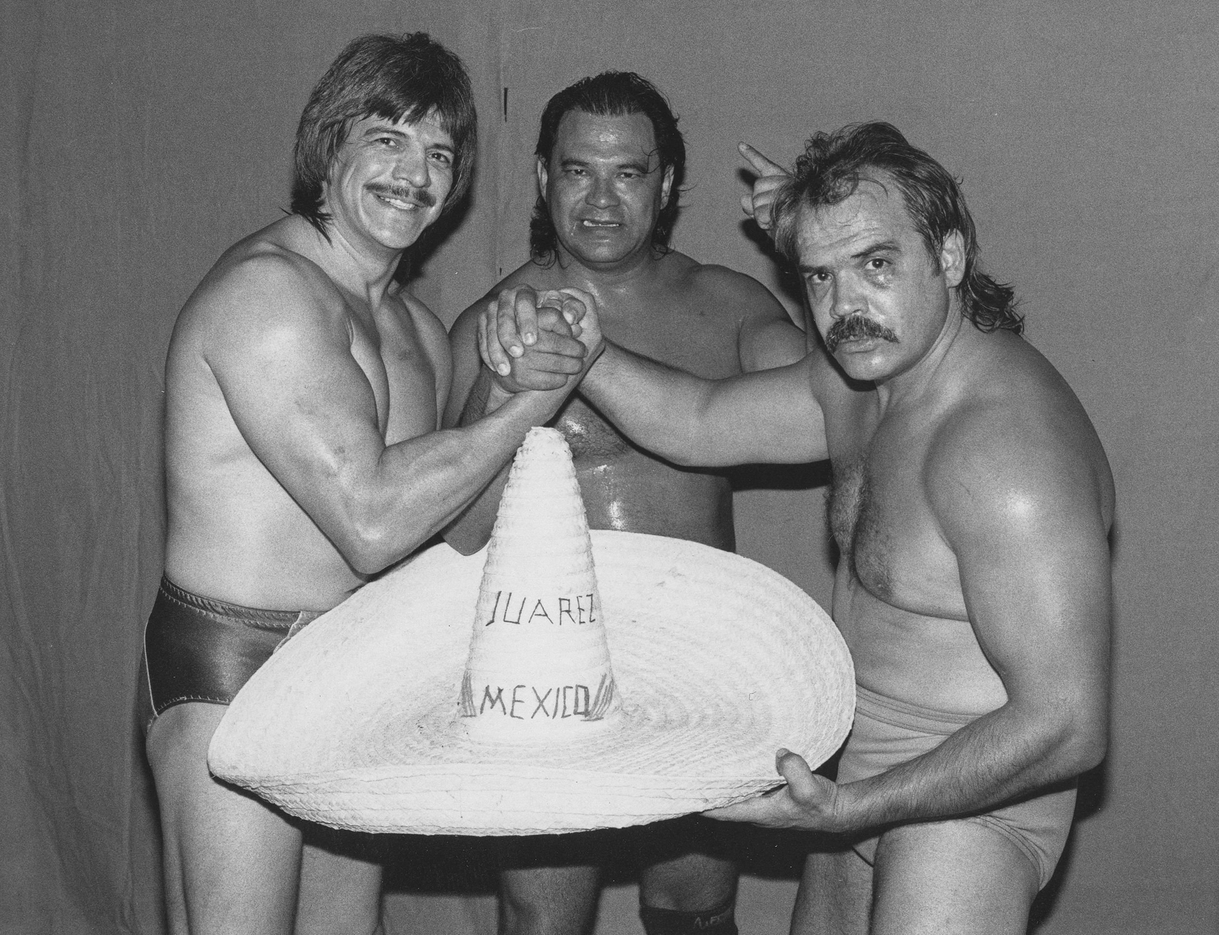 Eddie Guerrero: Legado Inmortal en la Lucha Libre y el Corazón Latino 3 In the Guerrero household, wrestling was a family affair: Hector Guerrero, left, Chavo Guerrero Sr., center, and Mando Guerrero, right.