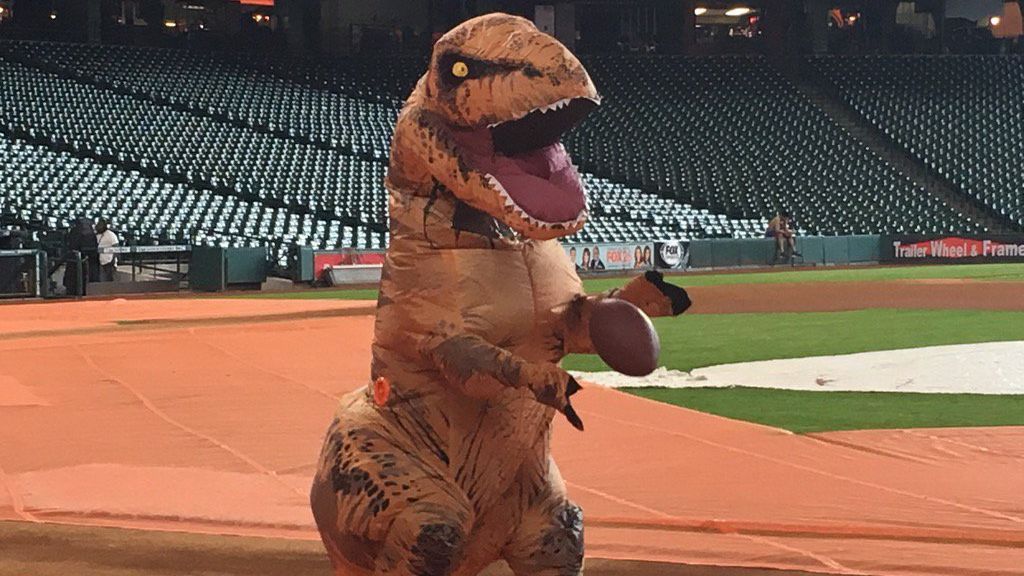 Houston Astros liven things up with football, T-Rex costume