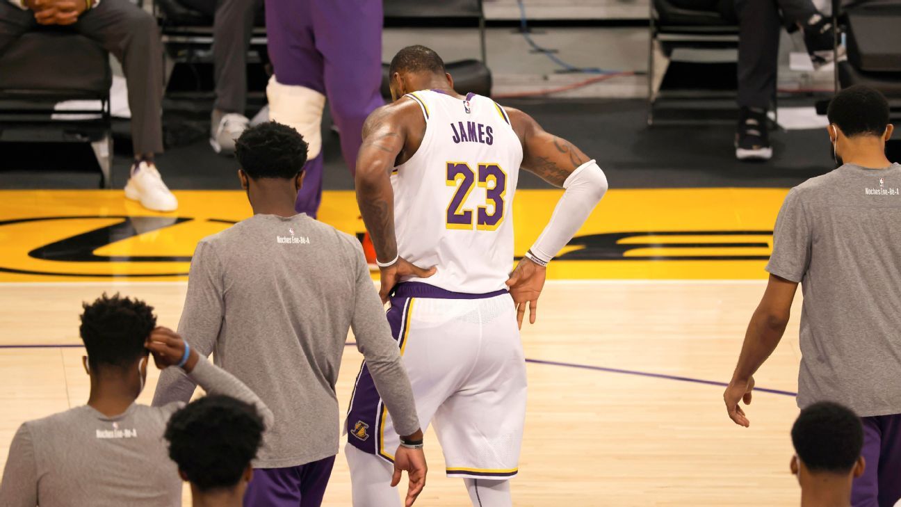Frustrated, LeBron James leaves the game at home for the Los Angeles Lakers in the first half due to an injury to his right ankle